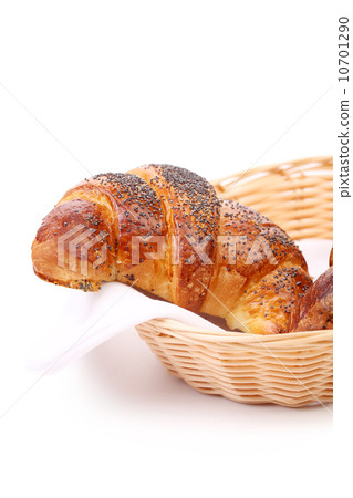 Image of croissant with poppy in a basket Image of croissant with poppy in a basket 10701290
