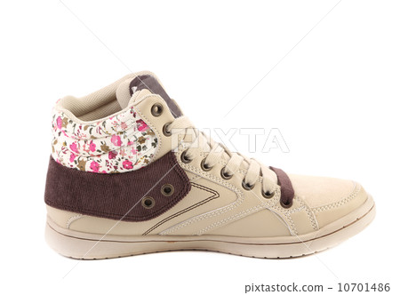 Fashion sneaker with flower closeup. Fashion sneaker with flower closeup. 10701486