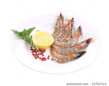 Raw shrimp with lemon and parsley. Raw shrimp with lemon and parsley. 10702324