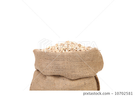 oat flakes in burlap sack bag 10702581