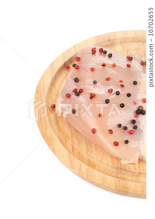 Raw chicken breast pepper on wooden board. Raw chicken breast pepper on wooden board. 10702655