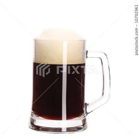 Tall big mug of brown beer with foam. Tall big mug of brown beer with foam. 10702961