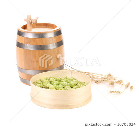 Wooden barrel and hops in basket. 10703024
