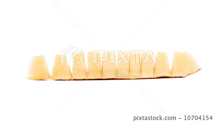 Slices of melon cut in pieces. Slices of melon cut in pieces. 10704154