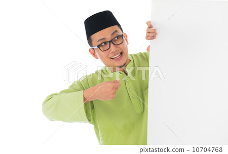 malay male with blank card during hari raya Eid al-Fitr aidilfit 10704768