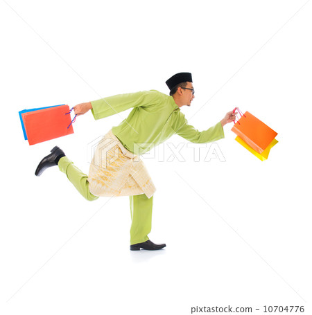 malay male with shopping bags during festival season malay male with shopping bags during festival season 10704776