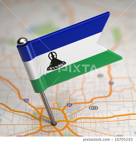 Lesotho Small Flag on a Map Background. 10705283
