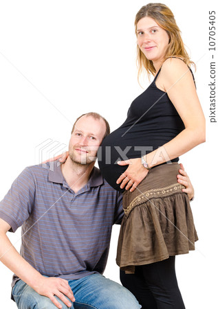 Happy man embracing beautiful pregnant woman isolated Happy man embracing beautiful pregnant woman isolated 10705405