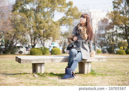 A woman in the park A woman in the park 10705567