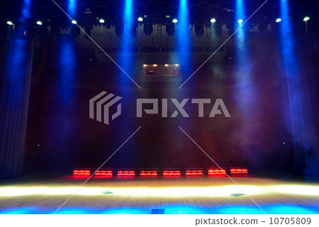 Illuminated empty concert stage with smoke 10705809