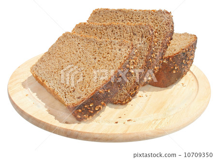 Bread on a chopping board. 10709350