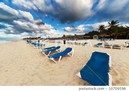 sun loungers on sandy beach sun loungers on sandy beach 10709596