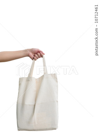Hand of woman holding Fabric bag 10712461