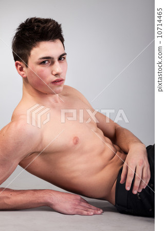 Healthy muscular young man on grey background 10714465