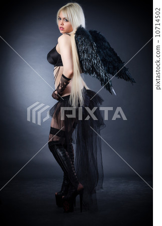 Blond female angel with black wings on a black background 10714502