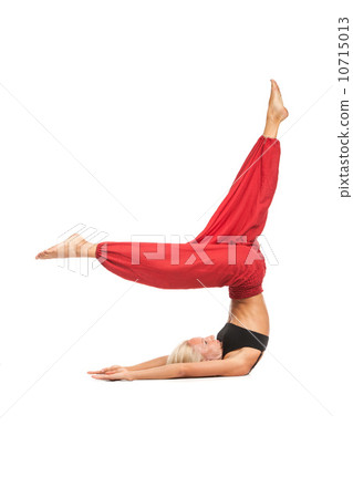 Practicing Yoga. Young woman isolated on white background Practicing Yoga. Young woman isolated on white background 10715013
