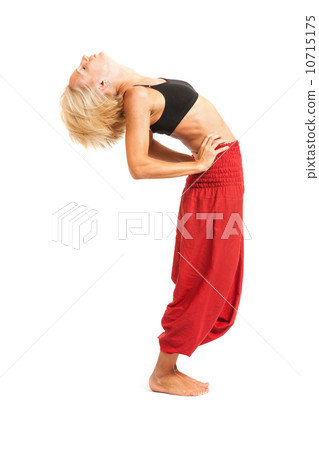 Practicing Yoga. Young woman isolated on white background Practicing Yoga. Young woman isolated on white background 10715175