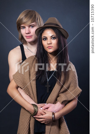 Portrait of happy young couple hugging Portrait of happy young couple hugging 10715390