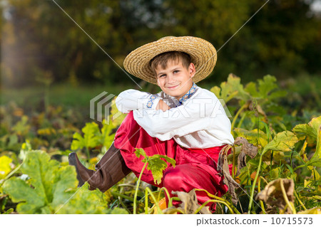 Cute child in traditional Ukrainian clothes outdoor 10715573