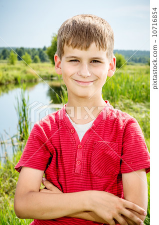 closeup of cute young teen boy smiling closeup of cute young teen boy smiling 10716854