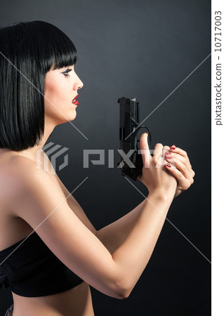 Beautiful woman with face art trying to make suicide 10717003