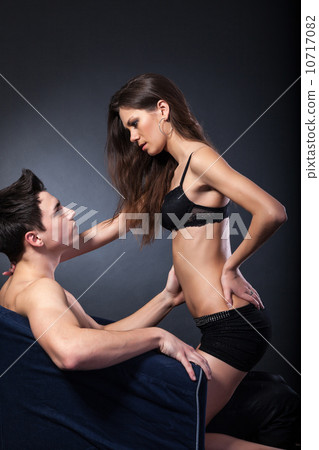 Portrait of happy young couple hugging 10717082