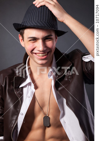 Healthy muscular young man on grey background 10717094