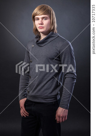 Healthy muscular young man on grey background 10717335