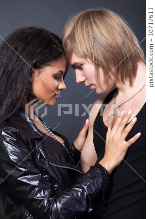 Portrait of happy young couple hugging 10717611