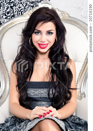 Young woman in a armchair. Retro style. 10718190