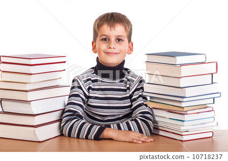 Schoolboy and a heap of books 10718237
