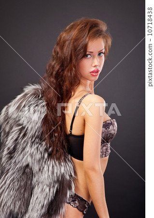 Attractive woman in fur coat and bra Attractive woman in fur coat and bra 10718438