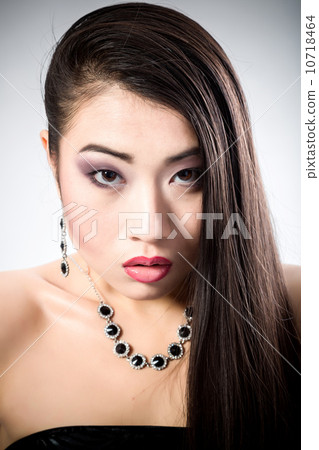 Beautiful brunette Asian woman with long black hair 10718464