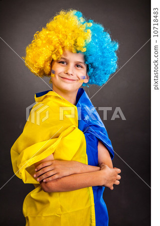 Football fan with  ukrainian flag on a black background 10718483