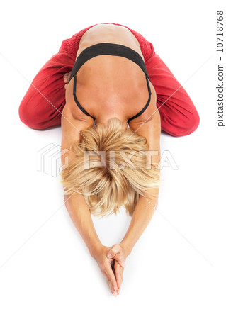 Practicing Yoga. Young woman isolated on white background Practicing Yoga. Young woman isolated on white background 10718768