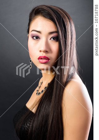 Beautiful brunette Asian woman with long black hair 10718788