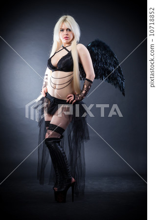 Blond female angel with black wings on a black background 10718852