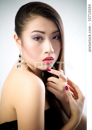 Beautiful brunette Asian woman with long black hair Beautiful brunette Asian woman with long black hair 10718884