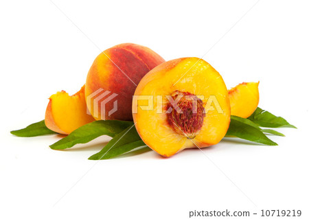 Three perfect, ripe peaches with a half and slices isolated on Three perfect, ripe peaches with a half and slices isolated on 10719219