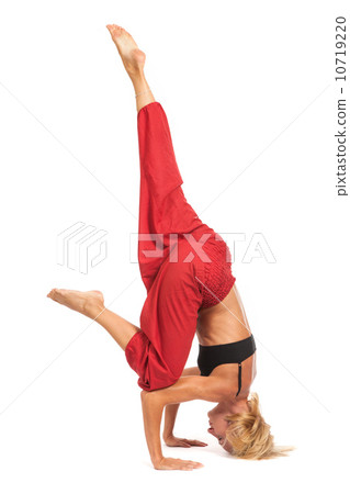 Practicing Yoga. Young woman isolated on white background Practicing Yoga. Young woman isolated on white background 10719220