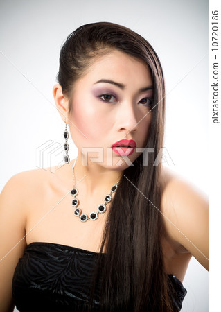 Beautiful brunette Asian woman with long black hair Beautiful brunette Asian woman with long black hair 10720186