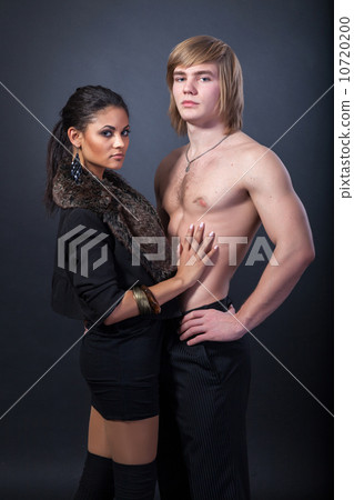Portrait of happy young couple hugging Portrait of happy young couple hugging 10720200