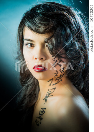 Beautiful brunette Asian woman with long black hair Beautiful brunette Asian woman with long black hair 10720205