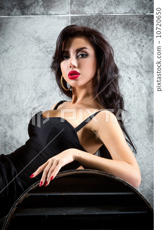 Portrait Of Sexy Woman On a dark metallic Background Portrait Of Sexy Woman On a dark metallic Background 10720650