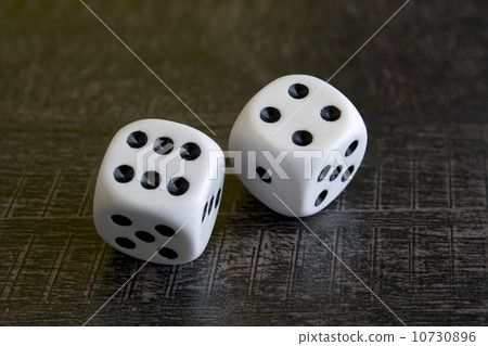 Two white dice gamble on a background 10730896