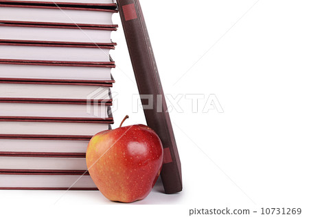 Book with apple isolated on white Book with apple isolated on white 10731269