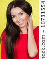 Woman in red dress on yellow background 10731554