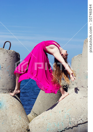 Young beautiful girl doing gymnastic  10746844