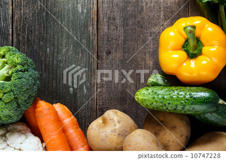 Vegetables on wood background with space for text. Organic food. 10747228