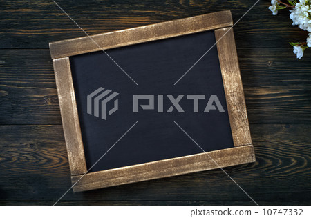 Old vintage school slate with flowers 10747332